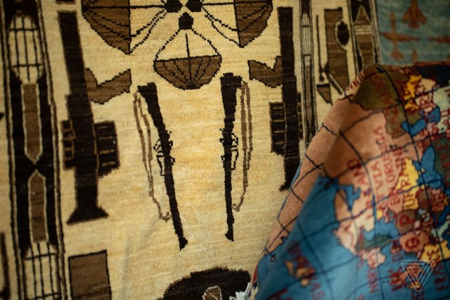 A tan rug showing guns.