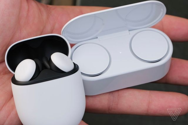 Microsoft’s Surface Earbuds pictured next to Google’s Pixel Buds.