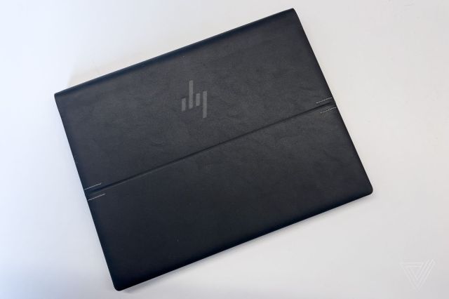 The HP Dragonfly Folio G3 closed on a white surface seen from above.