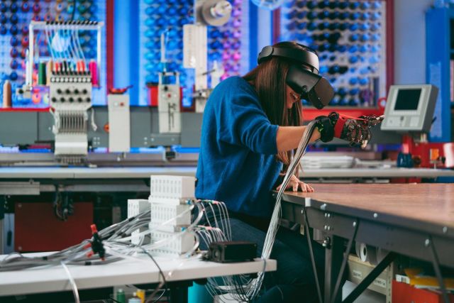Meta Reality Labs engineer Katherine Healy with a haptic glove