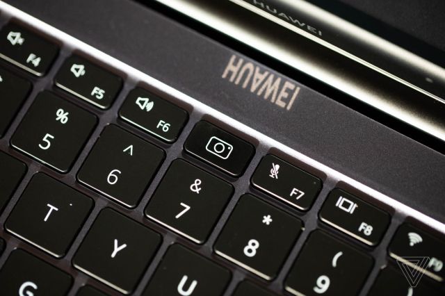 The webcam of the Huawei MateBook 16, depressed.