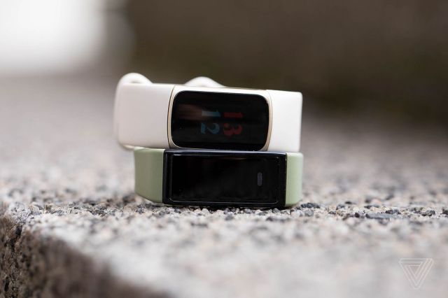 The Fitbit Charge 5 on top of the Amazon Halo View