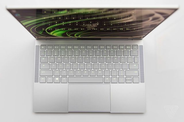 The Razer Book 13 keyboard seen from above. The keys display a green backlighting.