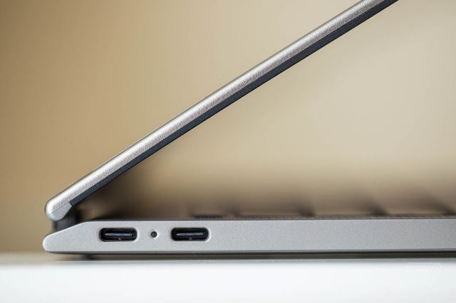 The Lenovo ThinkPad X1 Titanium Yoga seen from the left side half open.