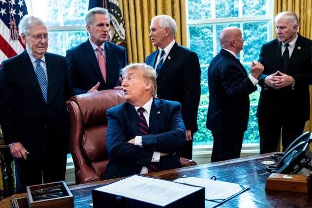 President Trump Signs Coronavirus Stimulus Bill In The Oval Office