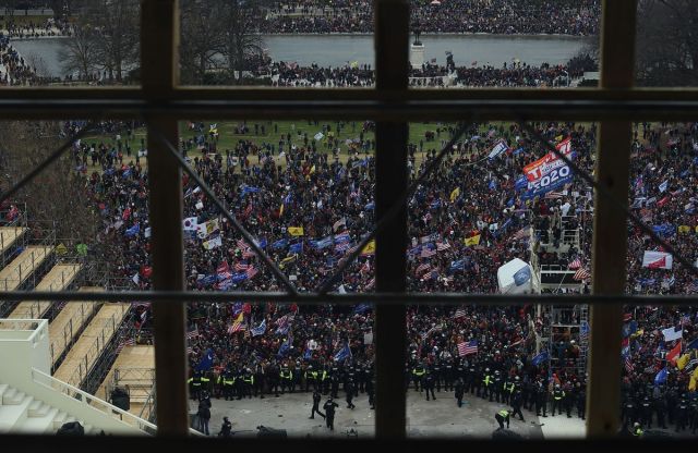 Supporters of US President Donald Trump gather outside the US Capitol’s Rotunda on January 6, 2021, in Washington, DC. - Demonstrators breeched security and entered the Capitol as Congress debated the a 2020 presidential election Electoral Vote Certification. (Photo by Olivier DOULIERY / AFP) (Photo by OLIVIER DOULIERY/AFP via Getty Images)