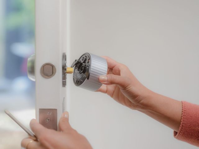 August Wi-Fi Smart Lock being installed on a door