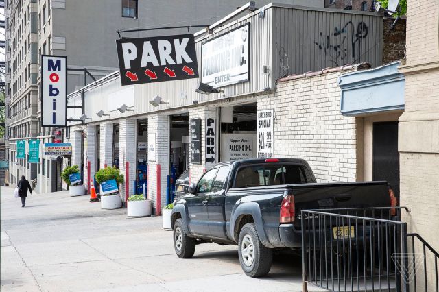 Electric vehicle charging stations in New York City are often inside paid parking lots. 