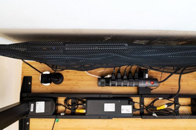 A view from underneath the desk shows the hidden storage.