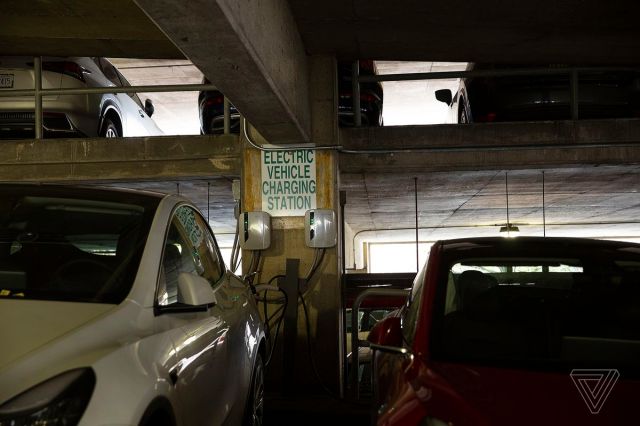 Electric vehicle charging stations in New York City are often inside paid parking lots. 