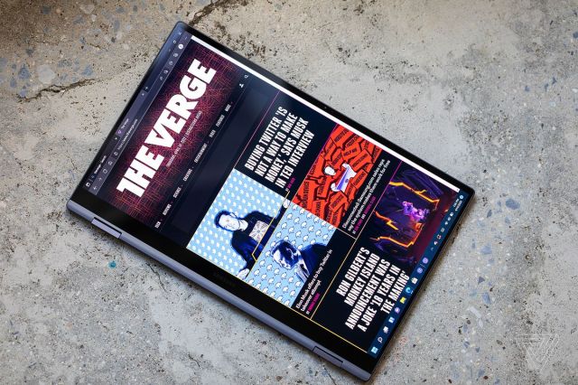 The Samsung Galaxy Book2 Pro 360 in tablet mode seen from above, displaying The Verge homepage.