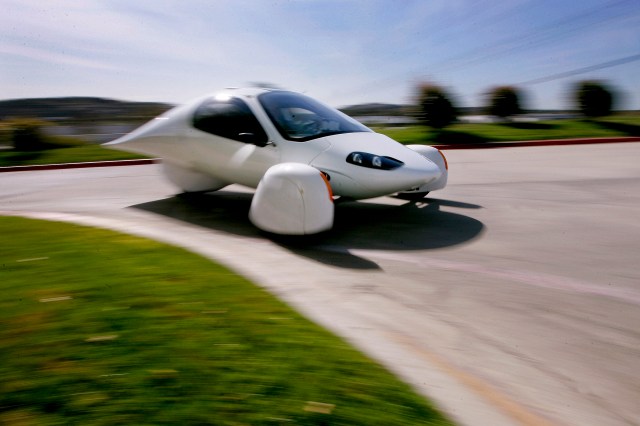 The Aptera 2e electric three-wheeled car is driven near the