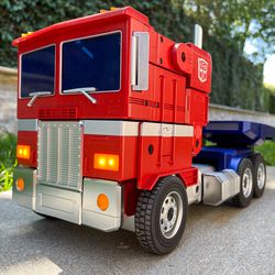 Optimus Prime in truck mode, with nice bright LED headlights and folding side mirrors.
