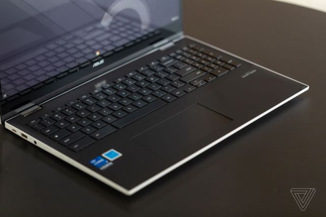 The Asus Chromebook CX5’s keyboard angled to the right, seen from above on a black table.