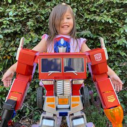 My daughter is much taller than Optimus but she wanted this picture.