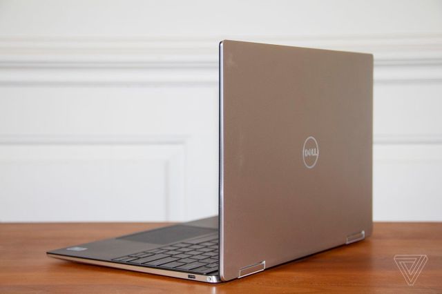 The Dell XPS 13 2-in-1 from the back, angled to the left.