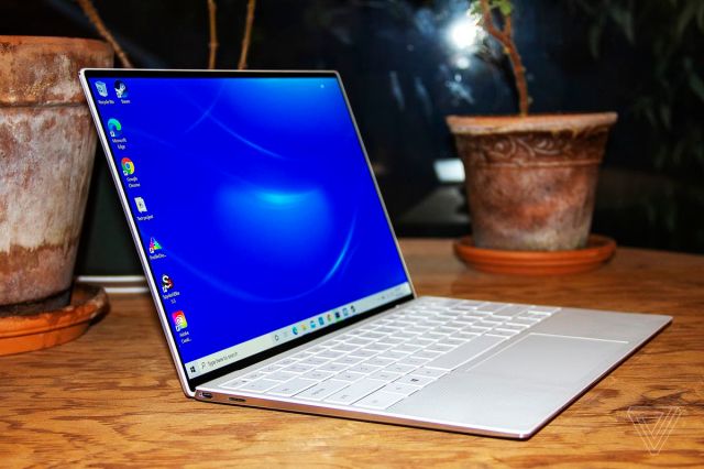 The Dell XPS 13 tilted back, angled to the left.