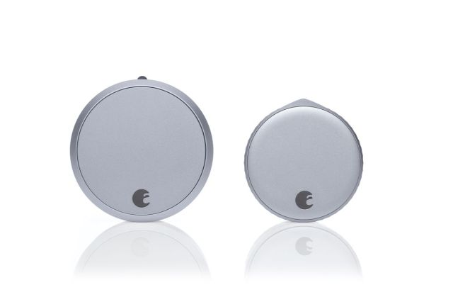 An August Smart Lock Pro next to an August Wi-Fi Smart Lock on a white background