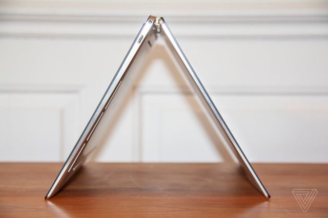 The Dell XPS 13 2-in-1 in tent mode, from the left side.