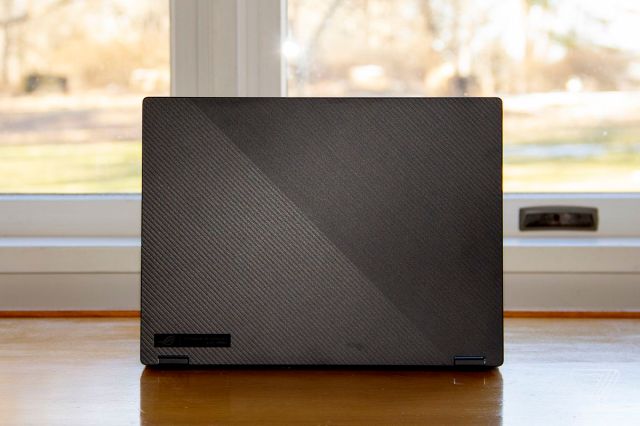 The ROG Flow X13 faces away from the camera.