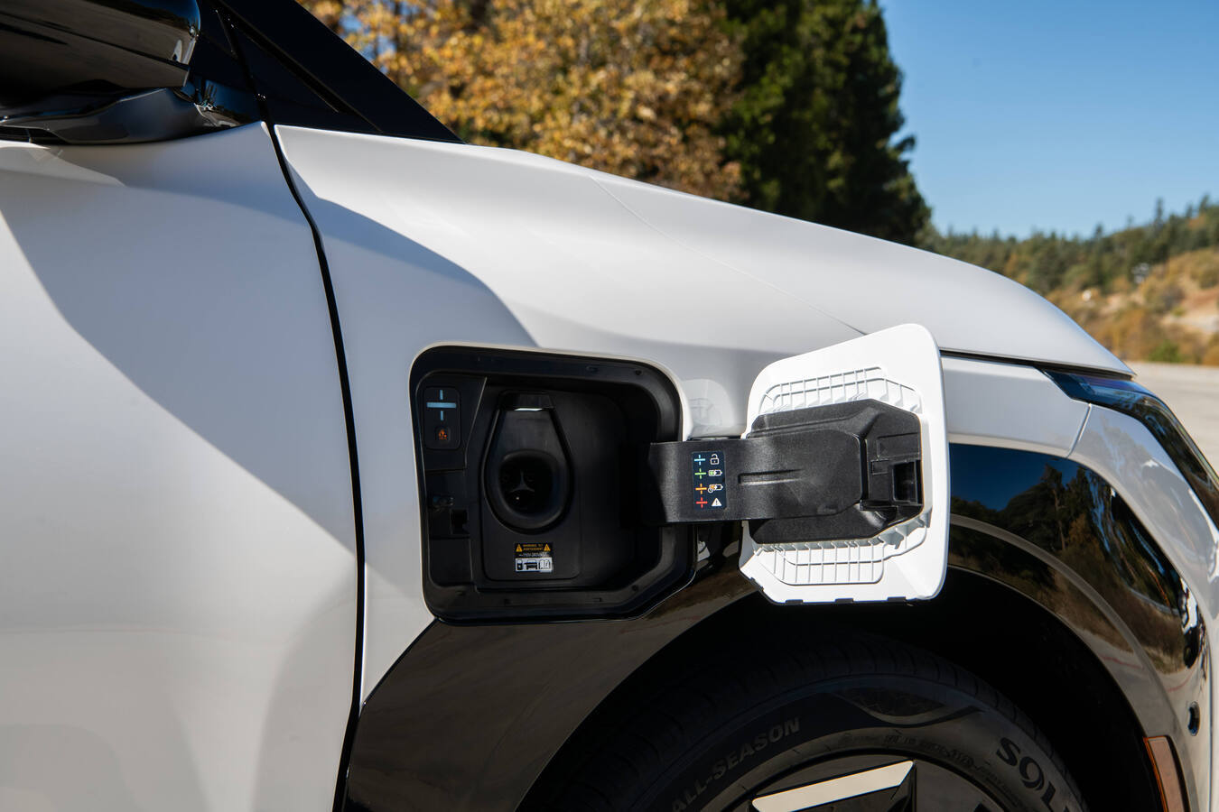 The Kia EV3's charging port on the vehicle's front passenger side
