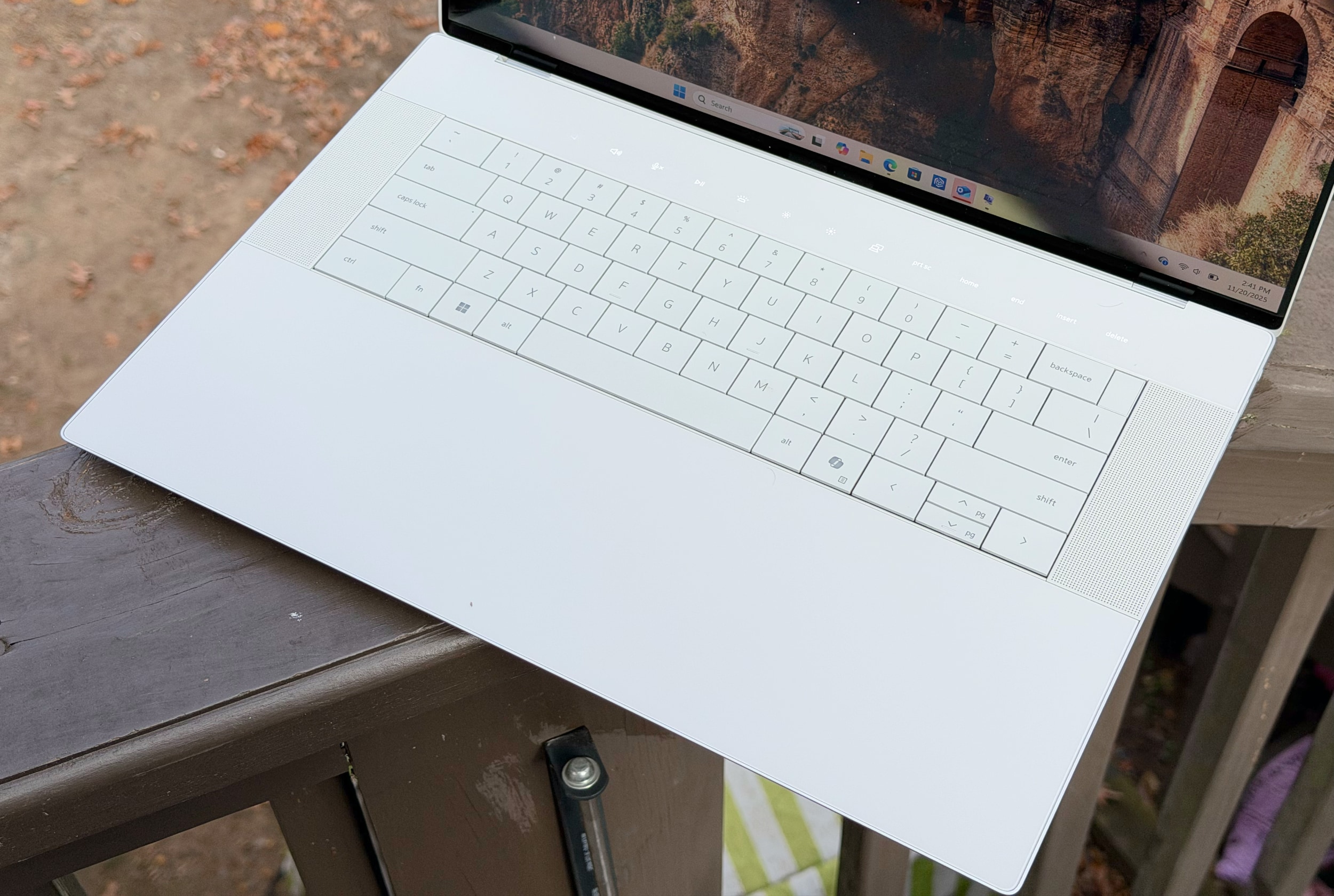 The 16 Premium's "invisible" trackpad blends seamlessly into its wrist rest, while the keyboard lays perfectly flat and a row of capacitive function keys sits above.