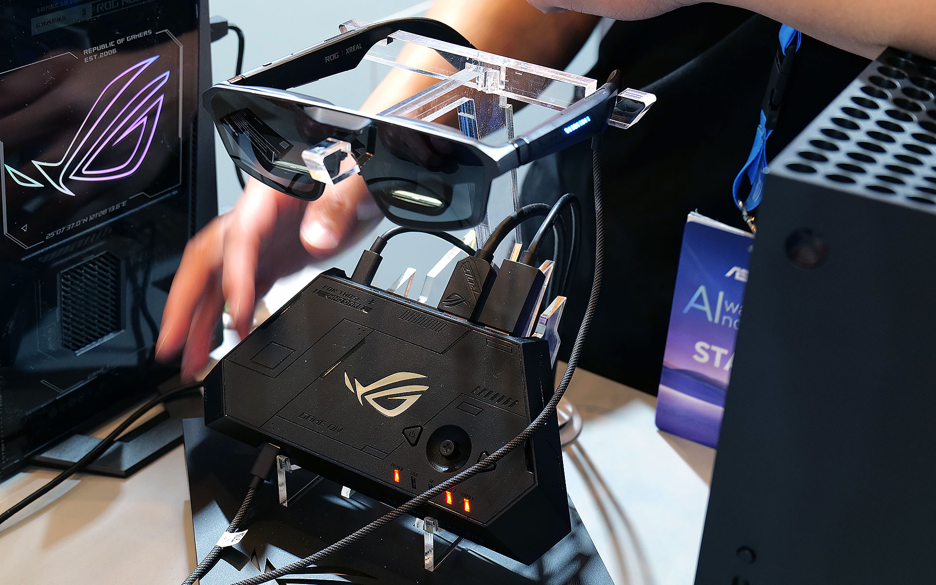 The ROG Control dock makes it easy to connect multiple devices to the ROG XREAL R1 AR smartglasses, but it may be a bit too bulky to pull out in tight situations like on a plane.