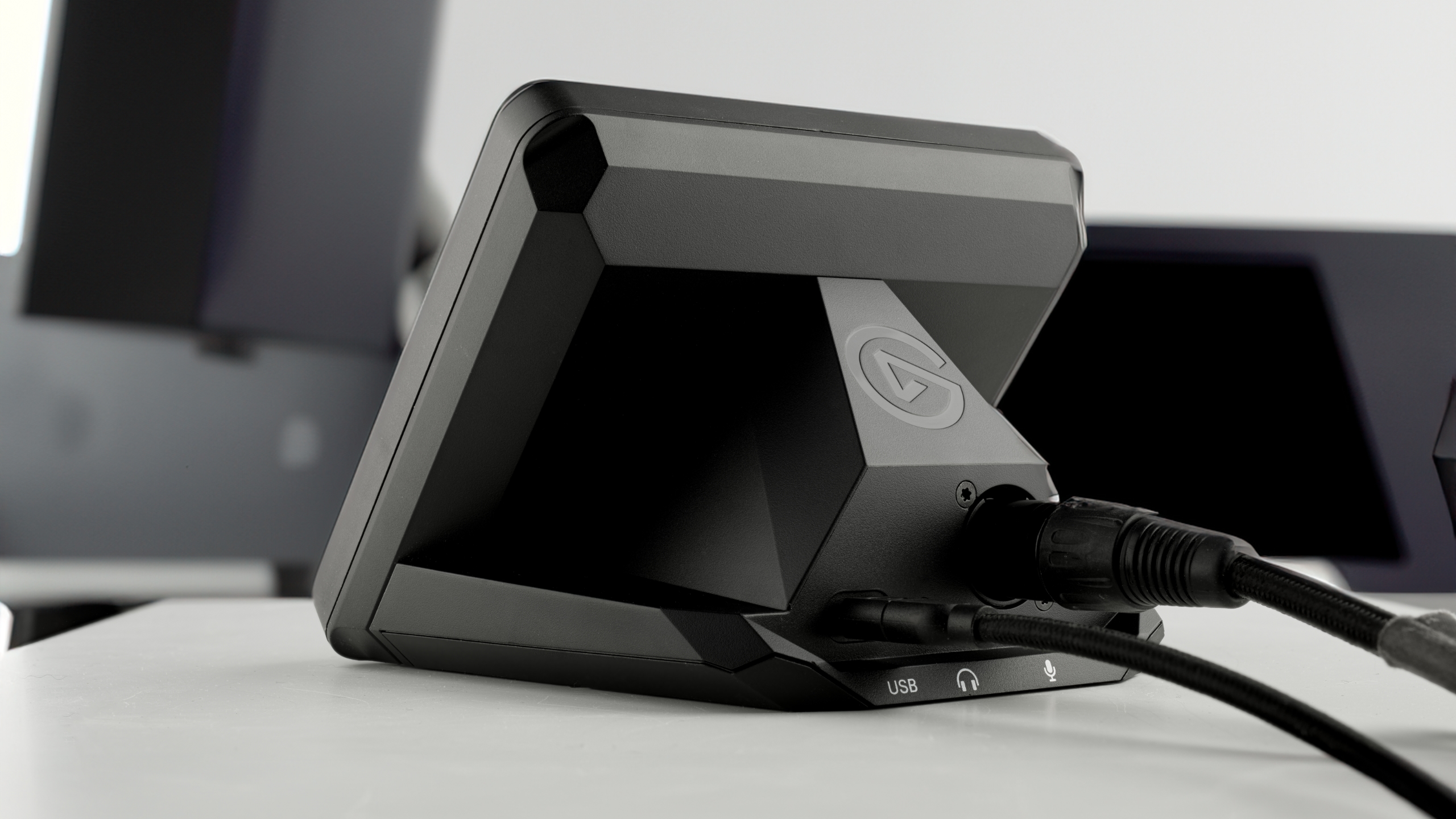The new XLR DOck MK. 2 on the back of a Stream Deck, with an XLR cable plugged in.