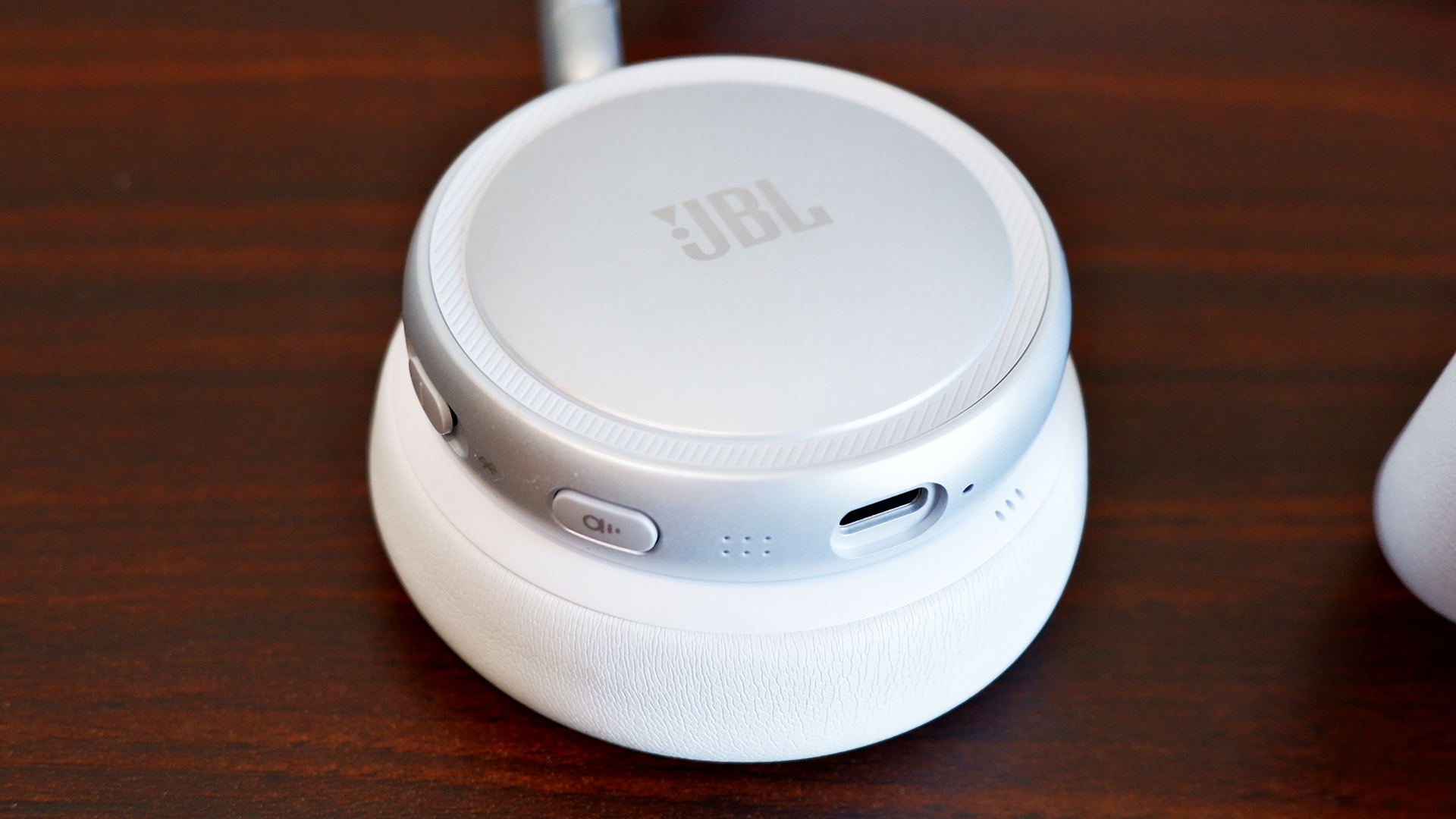 The ANC button and USB-C port on the Live 680NC