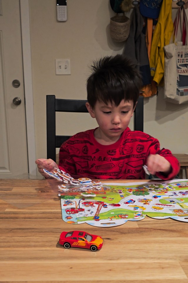Screengrab from the S24 Ultra of a child at a table playing with stickers