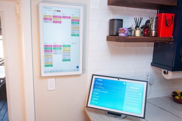 The Skylight Cal Max next to the Echo Show 21. The Show can be wall mounted or tabletop mounted, the Cal Max can only go on the wall. The Cal Max has a better calendar interface.