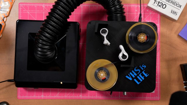 Top down image of the VHS cleaner with clean analog VHS tape.