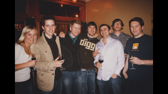 A photo of seven people drinking wine.