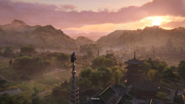 Screenshot from Assassin’s Creed Shadows featuring the shinobi Naoe siting atop a shinto temple observing the beautiful landscape.