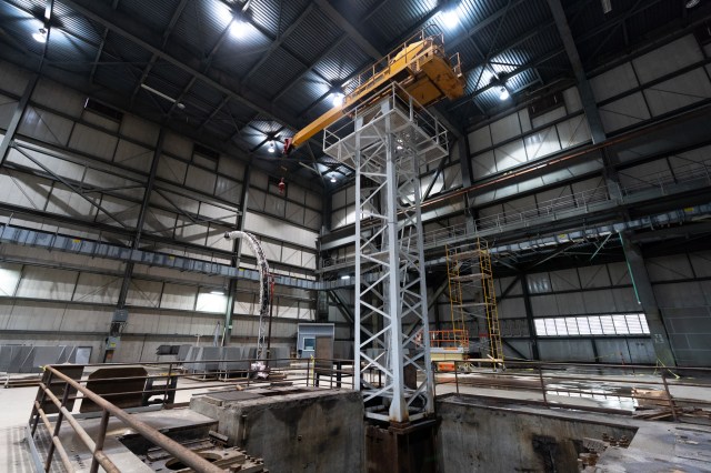 Sauro uses this crane to lift speakers into place on the free field testing rig, to the left.