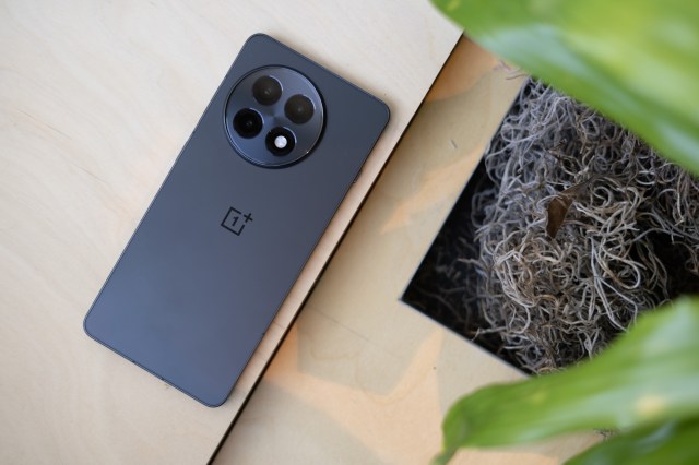 OnePlus 13R on a wooden table