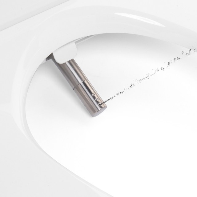 The wand of a bidet toilet seat, with water squirting out