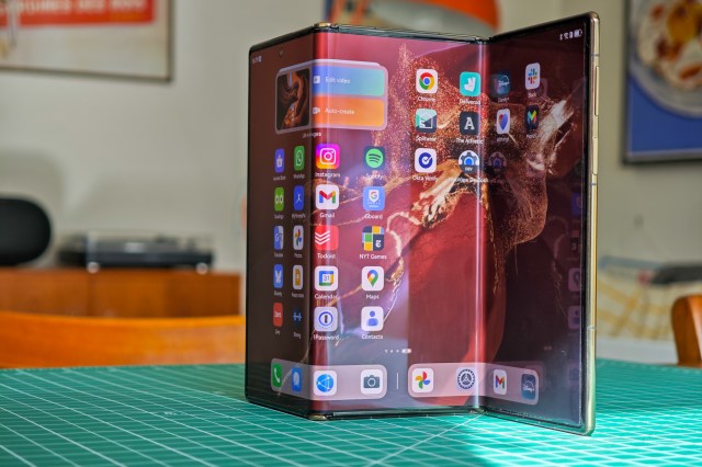 Huawei Mate XT standing open on a table