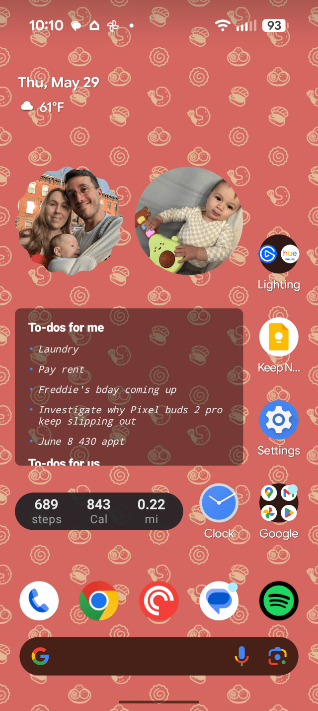 A smartphone homescreen with an orange background.