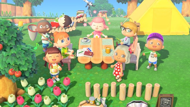 A group of players poses around a picnic table in Animal Crossing: New Horizons