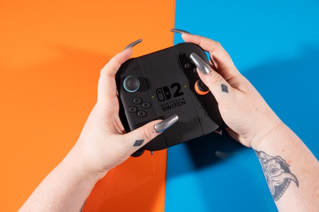 A photo of the Joy-Con 2 controllers for the Nintendo Switch 2 in a controller grip.