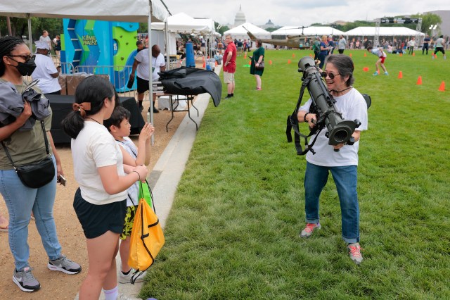 WASHINGTON, DC - JUNE 14: An Army festival attendee holds a M3 Carl Gustav Recoilless Rifle on June 14, 2025 in Washington, DC.