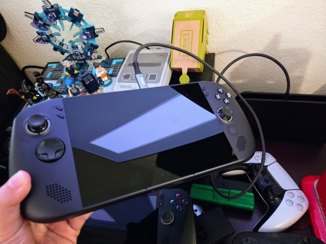 A Legion Go S with SteamOS plugged into the Switch 2 dock with a USB-C extension.