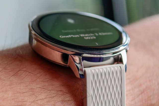 OnePlus Watch 3 43mm on a man’s wrist from a side angle