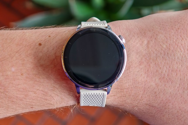 OnePlus Watch 3 43mm on a man’s wrist with the screen off