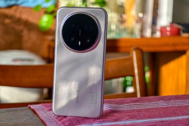Photo of Honor Magic 8 Pro on a wooden table showing the back of the phone