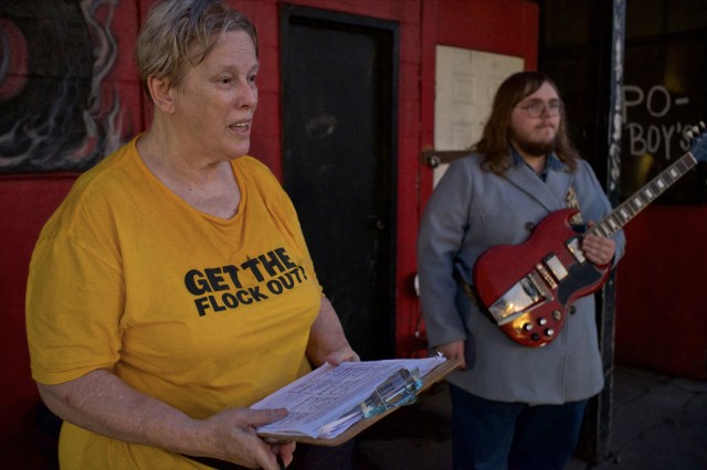 Candy Tapp, HCAG member, speaking with reporter about how many signatures she collected.
