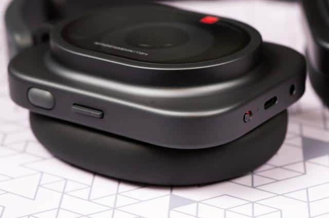 Macro shot of button and ports on a pair of Nothing Pro 1 headphones.