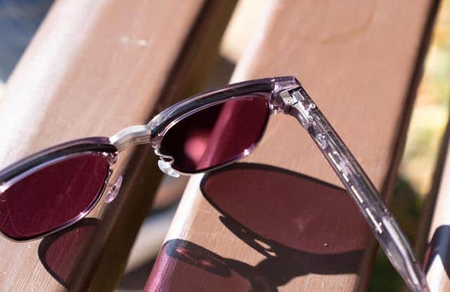 Close up of the hinge, action button, and toggle of the Ray-Ban Meta Audio glasses.