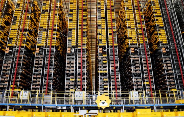Express parcels sit stacked at a logistic base of e-commerce giant Suning before the 618 Shopping Festival